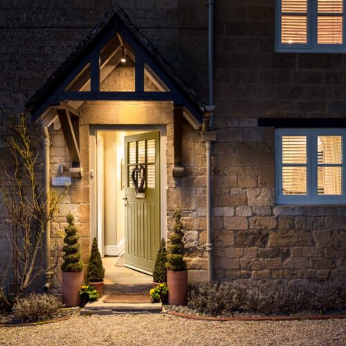 Outside Teachers House - Large Cotswold Holiday Home - evening, door opening to welcome you